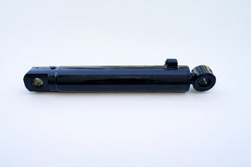Black hydraulic cylinder with mounting eyes.